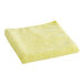 A yellow 3M Perfect-It microfiber detailing cloth.