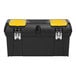 A Stanley black and yellow toolbox with four compartments and one tray.