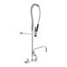 A Fisher pre-rinse faucet with a hose and swing nozzle.