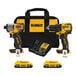 A yellow and black DeWalt cordless drill kit with battery charger in a yellow and black tool bag.