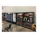 An All State Manufacturing stainless steel micro market stand with a variety of snacks and drinks on shelves.