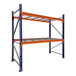 A blue and orange Interlake Mecalux heavy-duty bolted teardrop pallet rack with wire deck shelves.