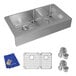 A Zurn Elkay stainless steel double bowl undermount sink with accessories and a grid inside.