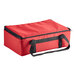 A red nylon insulated food carrier with black straps.