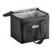 A Sterno black nylon insulated delivery food carrier with a handle and zipper on a counter.