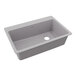 A Zurn Elkay Quartz Classic greystone sink with a center drain.