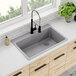 A Zurn Elkay Quartz Classic drop-in sink with a faucet above it.
