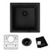 A Zurn Elkay black quartz bar sink with a drain and accessories installed in a home kitchen counter.