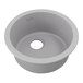 A greystone round quartz sink with a hole in the center.