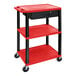 A red and black Luxor plastic utility cart with three shelves, locking drawer, and electrical assembly.