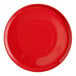 A close-up of a red Acopa stoneware pizza plate with a circle in the middle.