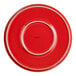 An Acopa red stoneware pizza plate with a white rim.