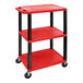 A red and black plastic Luxor utility cart with three shelves and wheels.