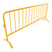 A yellow metal crowd control barrier with curved feet.