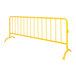 A yellow metal fence with curved feet.