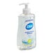A bottle of Dial antibacterial White Tea liquid hand soap on a counter.