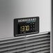 The control panel of a Hoshizaki refrigerated pizza prep table with a digital temperature display.