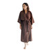 A woman wearing a brown Telegraph Hill seersucker kimono robe.