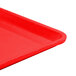 A close up of a red Cambro dietary tray.
