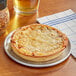 A Tony's deep dish whole grain cheese pizza on a plate.