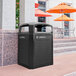 A black Rubbermaid medium "Landfill" decorative panel on a black outdoor trash can.