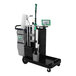 An Unger SpotCleanRx spot cleaning janitorial cart with black and green components and cleaning supplies.