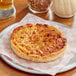 A Tony's Deep Dish cheese pizza on a plate.