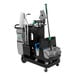 A Unger DeepCleanRx cleaning cart with green and black buckets and a mop.