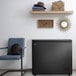 A black Danby chest freezer in a room in a home.