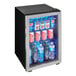 A compact stainless steel beverage refrigerator with a glass door displaying assorted drinks.