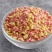 A bowl of Yum Crumbs strawberry lemonade crumb topping.