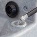 A Lavex double mobile hand wash station with water pouring out of a sink hose.