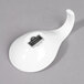 A white porcelain tapas spoon with a black logo.
