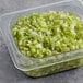 A container of chopped celery.