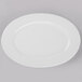 A Libbey Porcelana white porcelain platter with a wide rim.