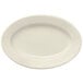 A Libbey white porcelain oval platter with a wide rim.