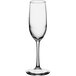 A close-up of a clear Libbey Vina flute glass with a long stem.