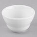 A Libbey Porcelana bright white porcelain bouillon bowl with a lid on a white surface.