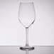 A Libbey Vina tall wine glass on a reflective surface.