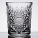 A Libbey Hobstar double old fashioned glass with a design on it.