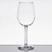 A clear Libbey Vina wine glass on a white table.