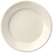 A close up of a Libbey Porcelana cream white plate with a white rim.