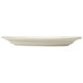 A Libbey Porcelana cream white oval platter with a wide rim on a white surface.