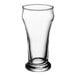 A close-up of a Libbey clear Pilsner glass with a base.