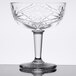 A Libbey coupe cocktail glass with a star design on the bowl.