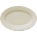 A Libbey Porcelana cream white oval platter with a wide rim.