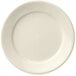 A close-up of a Libbey Porcelana Cream white porcelain plate with a plain edge.