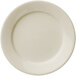 A Libbey Porcelana cream white plate with a wide white rim.