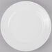 A Libbey Porcelana white porcelain plate with a wide white rim.