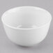 A Libbey Porcelana white porcelain noodle soup bowl on a gray surface.